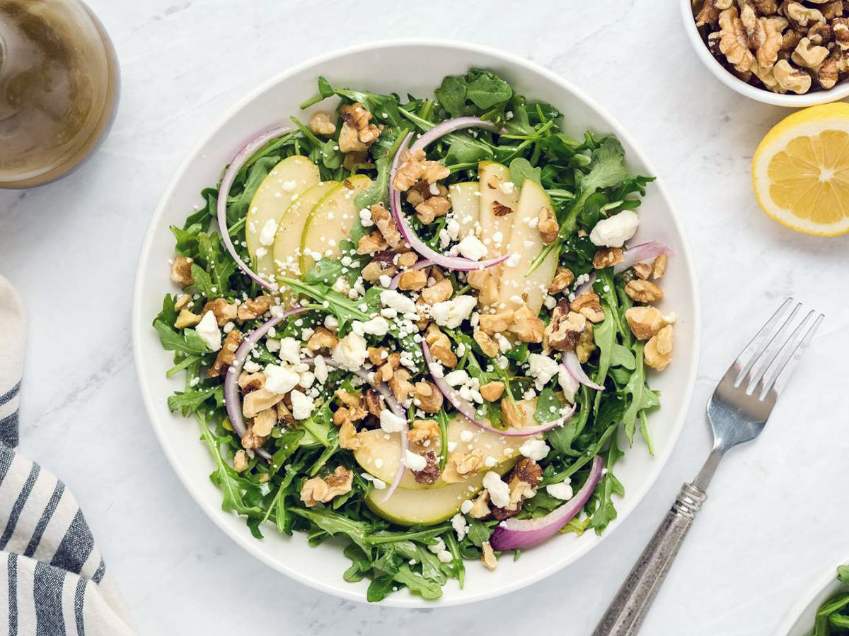 Fresh Arugula Salad, Packed With goat cheese,Walnuts, Red Onions, and a Delicious Lemon Balsamic Vinaigrette