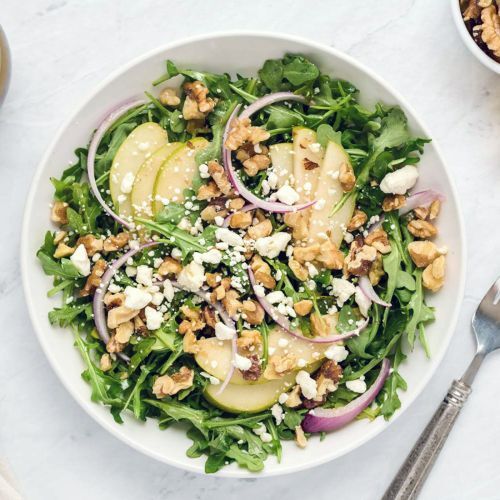 Fresh Arugula Salad, Packed With goat cheese,Walnuts, Red Onions, and a Delicious Lemon Balsamic Vinaigrette