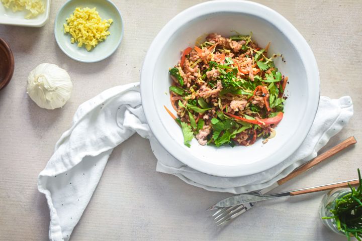 Asian quinoa and turkey stir fry with lean ground turkey, cooked quinoa, fresh vegetables, and stir fry sauce.