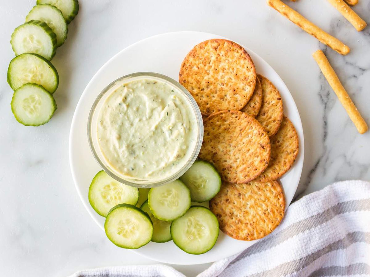 Creamy Avocado Ranch Dip with Crackers and Cucumbers