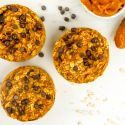 Baked pumpkin oatmeal with chocolate chips and a spoon of pumpkin.