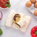 Freezer friendly breakfast burritos with eggs, black beans, peppers, salsa, and onions.