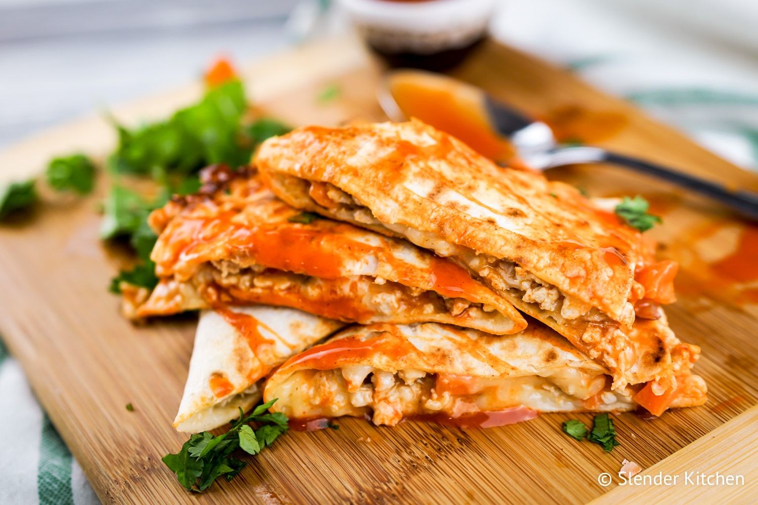 Make ahead lunch prep of a chicken buffalo quesadilla with cilantro.