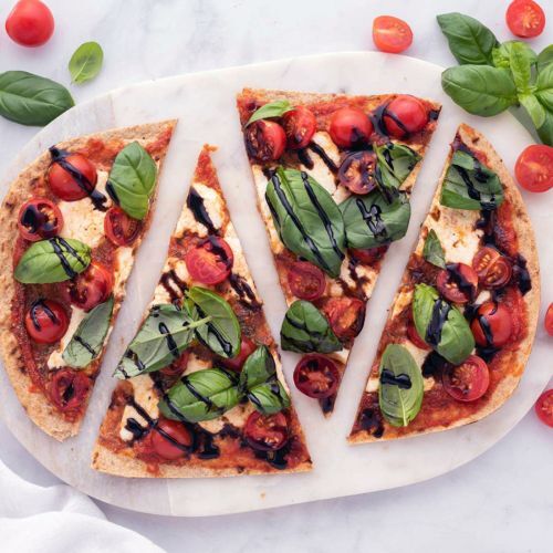 Caprese Flatbead With Cherry Tomatoes, Fresh Mozzarella, Basil Leaves, and Balsamic Vinegar