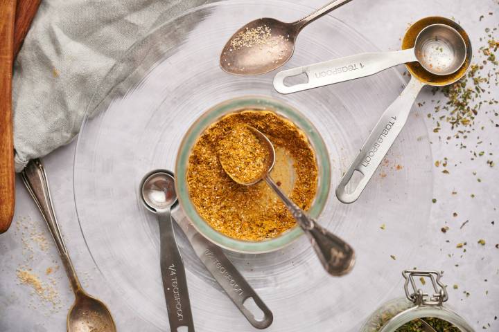 Chicken taco seasoning chili powder, cumin, garlic powder, onion powder, oregano in a glass jar.