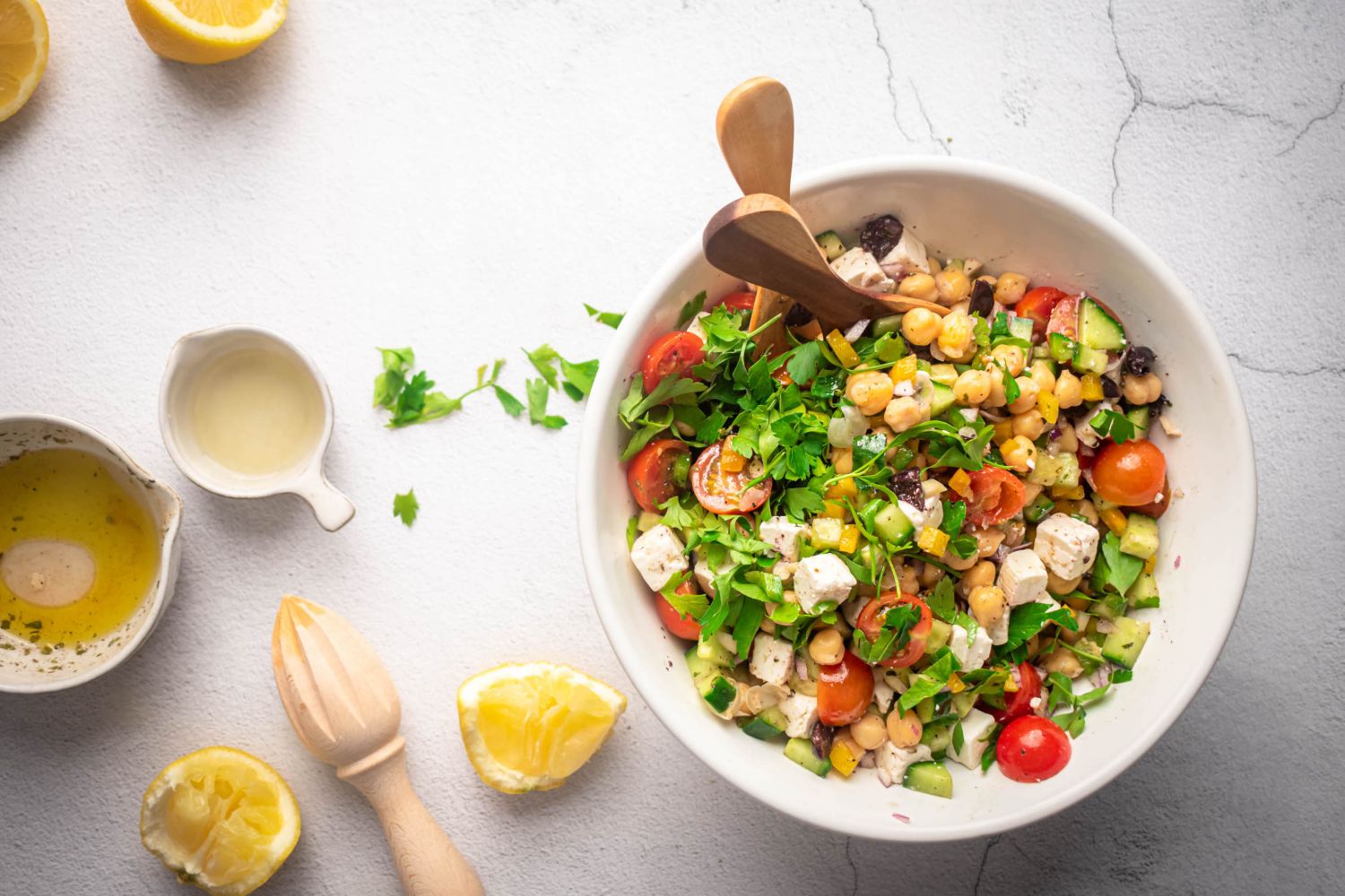 Chopped chickpea Greek salad ieth chickpeas, cucumbers, feta, olives, and fresh herbs in a lemon dressing.