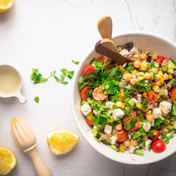 Chopped chickpea Greek salad ieth chickpeas, cucumbers, feta, olives, and fresh herbs in a lemon dressing.