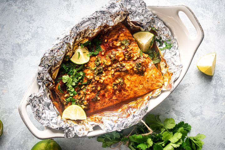 Cilantro lime salmon cooked in foil with garlic, lime juice, cilantro, and honey.