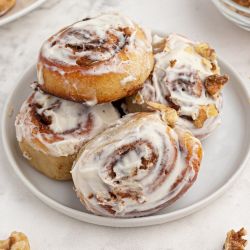 Easy cinnamon rolls made with two ingredient dough and topped with cream cheese glaze and cinnamon.