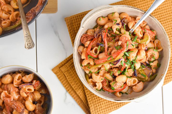 Creamy Cajun Chicken Pasta with peppers, onions, chicken breast, and a creamy cajun sauce in a bowl.