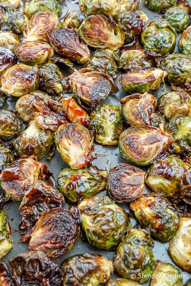 Asian Brussels sprouts recipe on a sheet pan with browned edges.