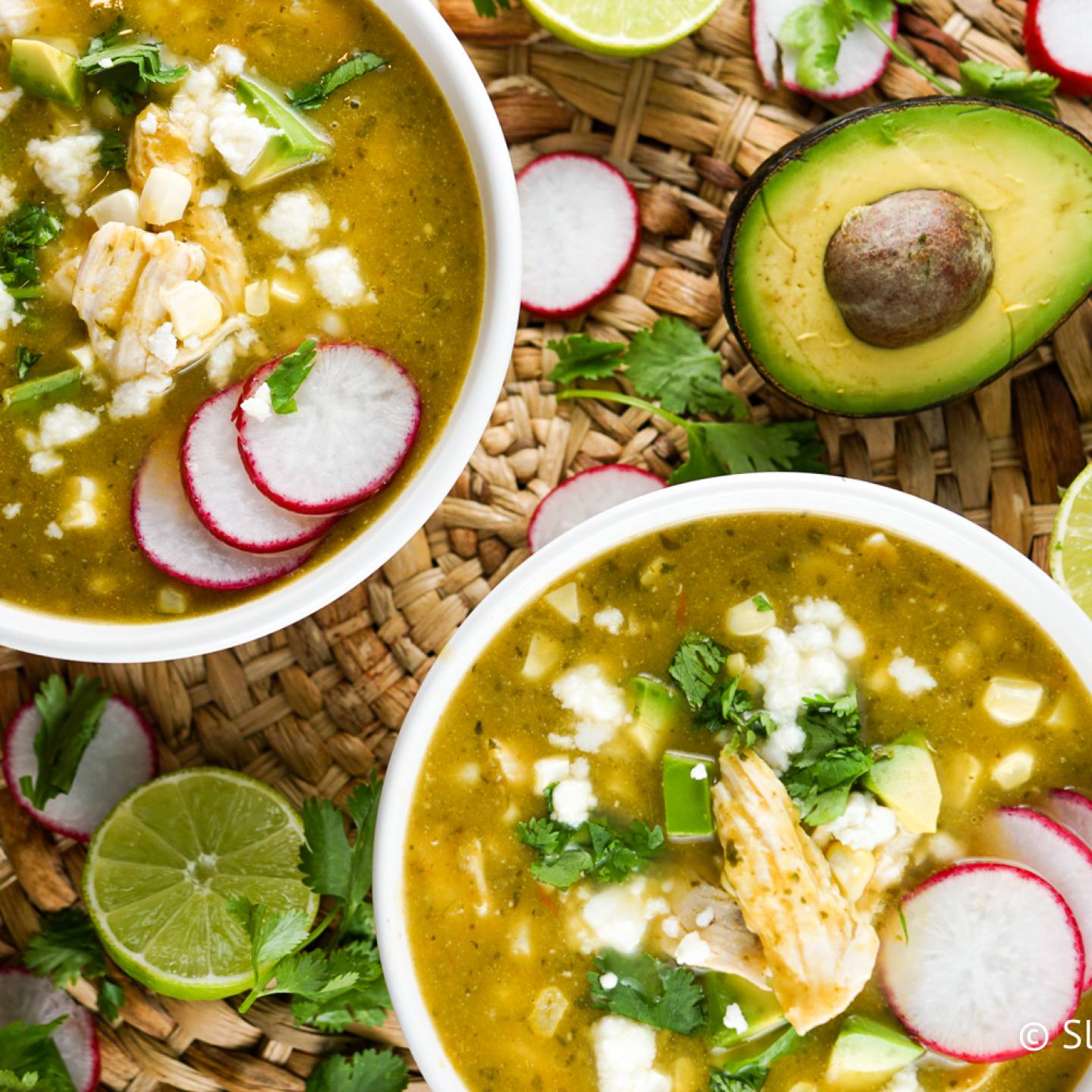 Chicken tortilla soup with fresh corn, cilantro, avocado, and queso fresco/