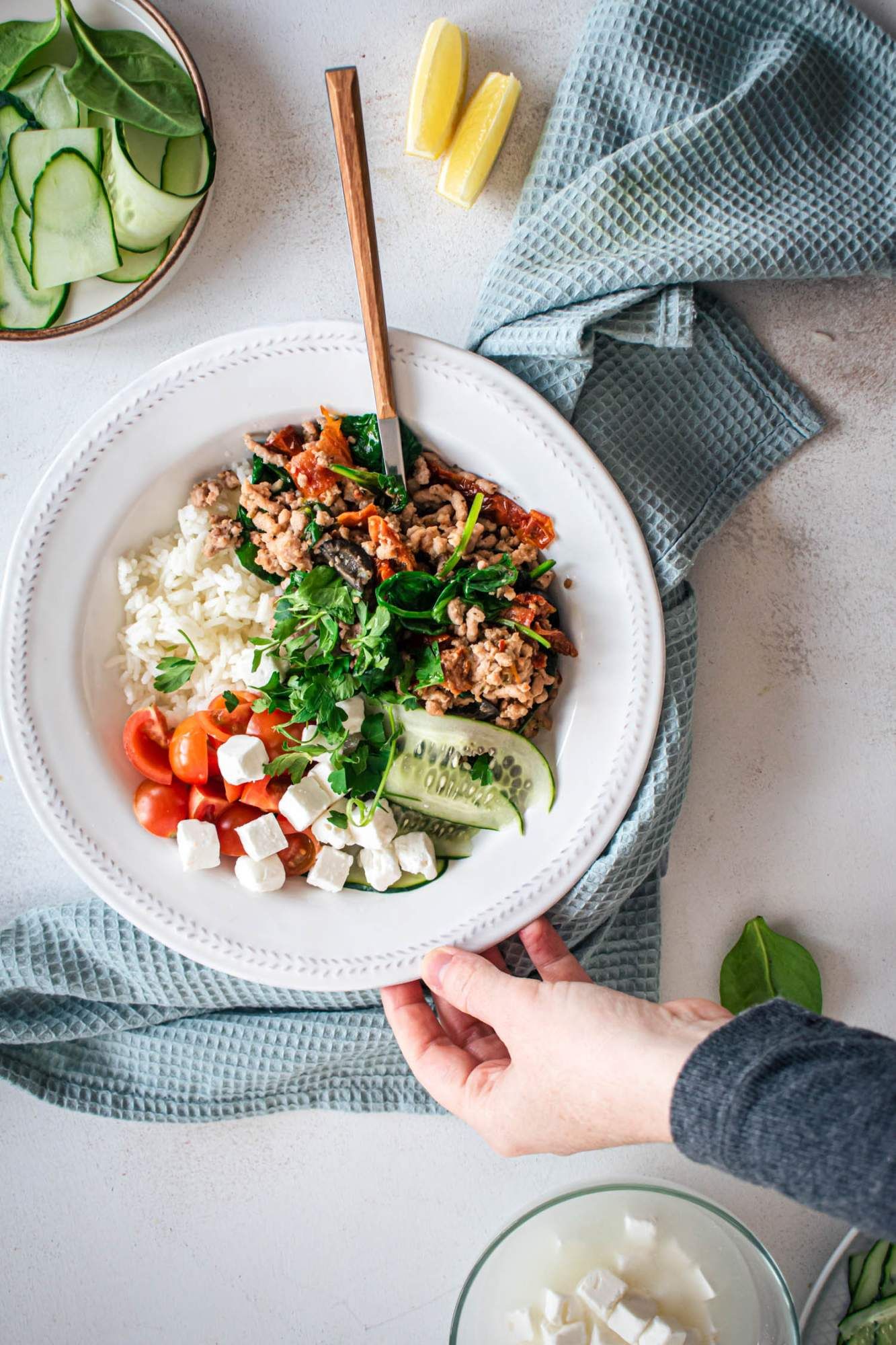 Ground turkey bowl with Greek flavors including kalamata olives, sundried tomatoes, oregano, feta cheese, parsley, and cucumbers.