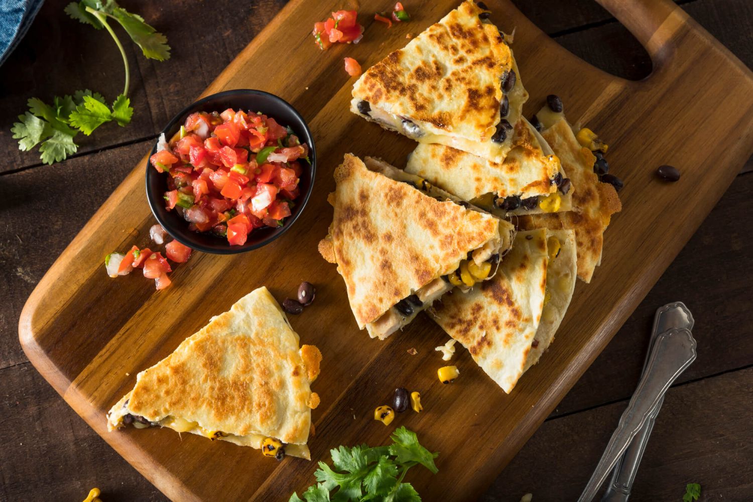 Healthy chicken quesadillas with pico de gallo on the side.