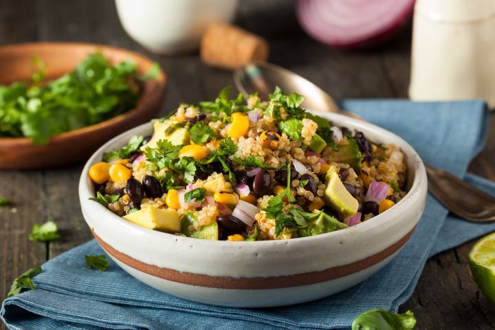 Mexican Quinoa Salad with black beans, cooked quinoa, corn, cilantro, and a creamy avocado dressing.