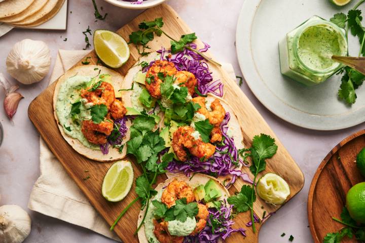 Mexican seafood tacos made with shrimp, avocado, and cilantro lime sauce. 