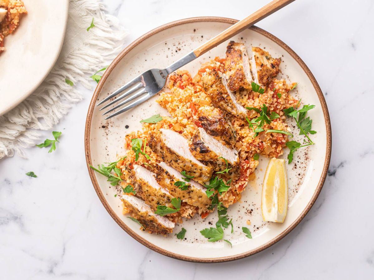 Garlic Parmesan Chicken on a Pretty Plate Served with Cauliflower Rice