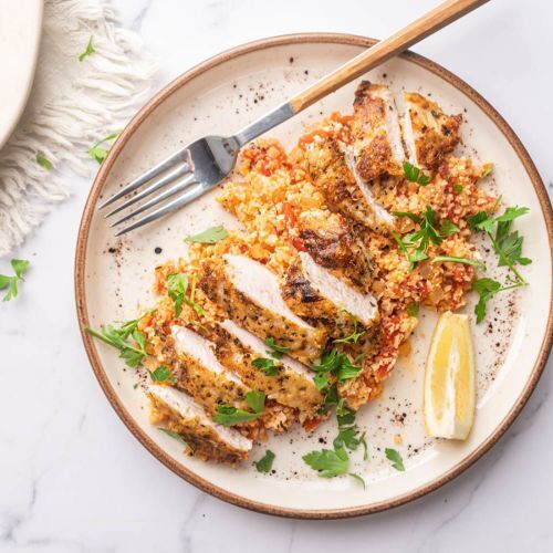 Garlic Parmesan Chicken on a Pretty Plate Served with Cauliflower Rice