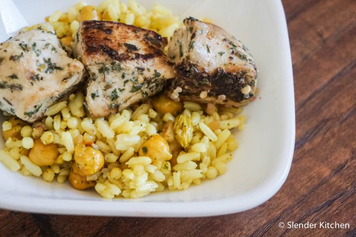 Persian chicken kabobs marinated in yogurt and spices and served over a couscous salad.