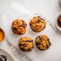 Pumpkin chocolate chip oatmeal muffins with canned pumpkin and chocolate chips on the side.