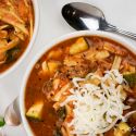 Slow Cooker lasagna soup in a crockpot with noodles, beef, and zucchini.