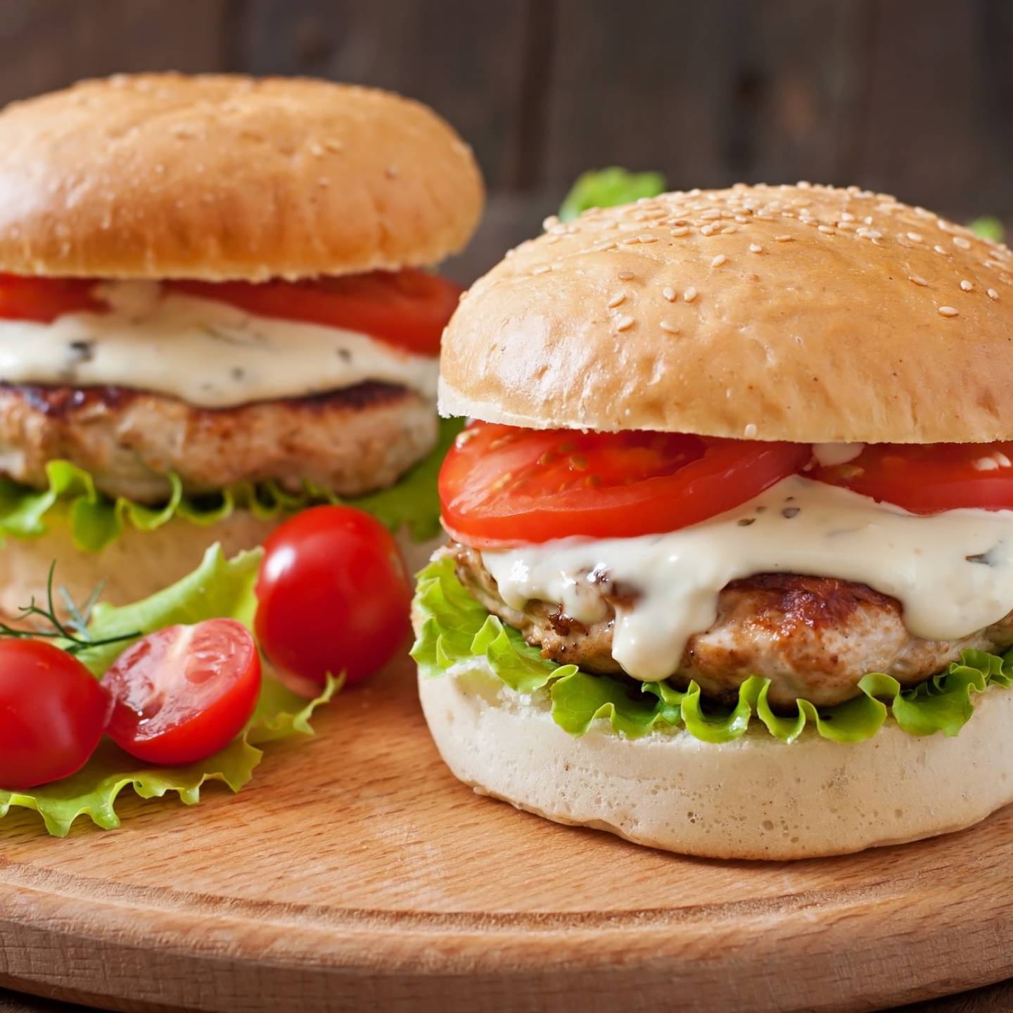 Turkey ranch burgers with a wheat bun, lettuce, and tomato.