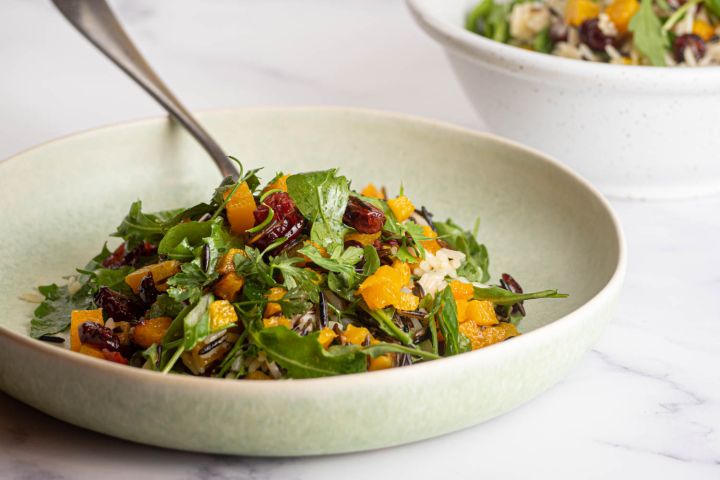 Wild rice salad with acorn squash, cranberries, arugula, and a lemon dressing.