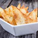 Crispy Wonton chips in a bowl with salt and pepper.